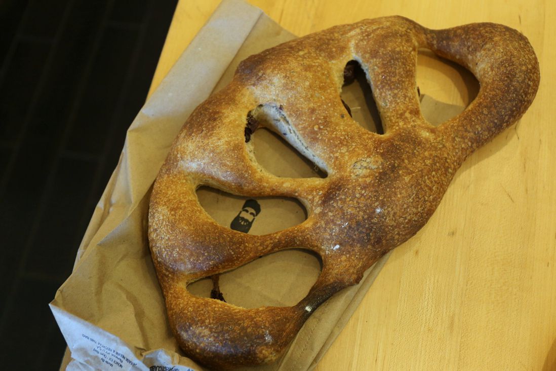 Fougasse: sourdough bread with Kalamata olives and fresh thyme ($10)<br/>